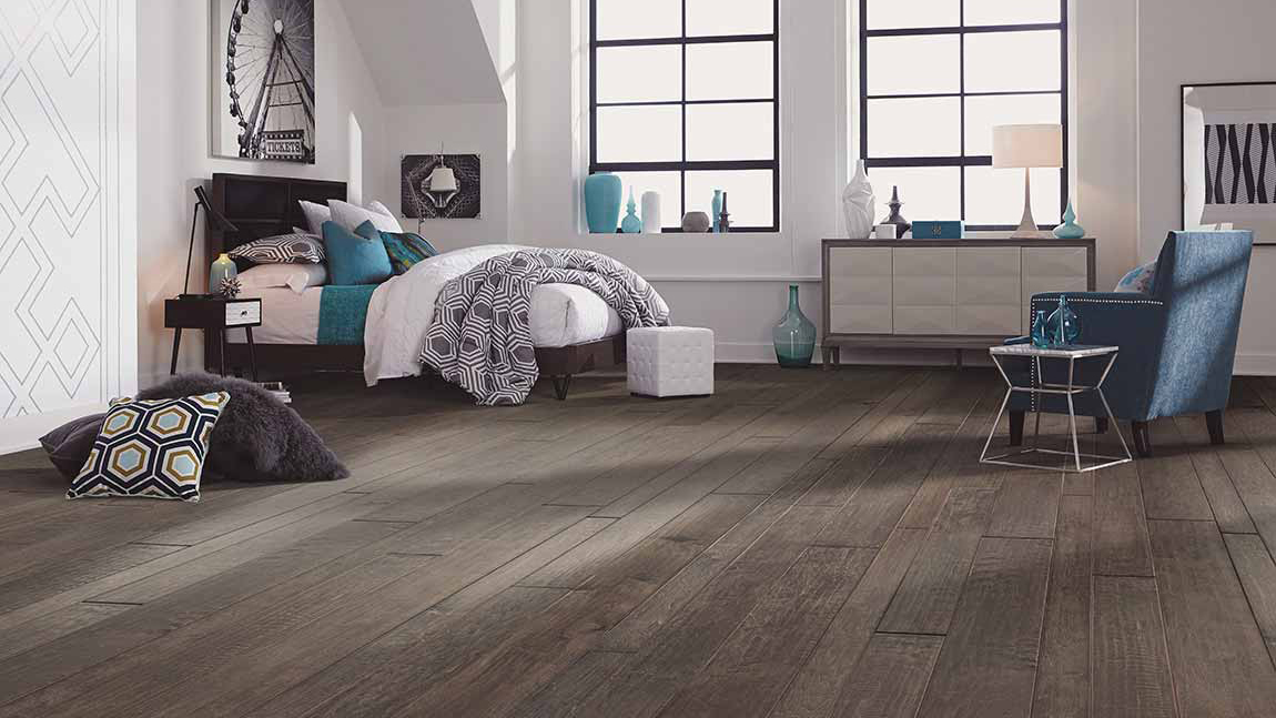 Hardwood floors in a bedroom.